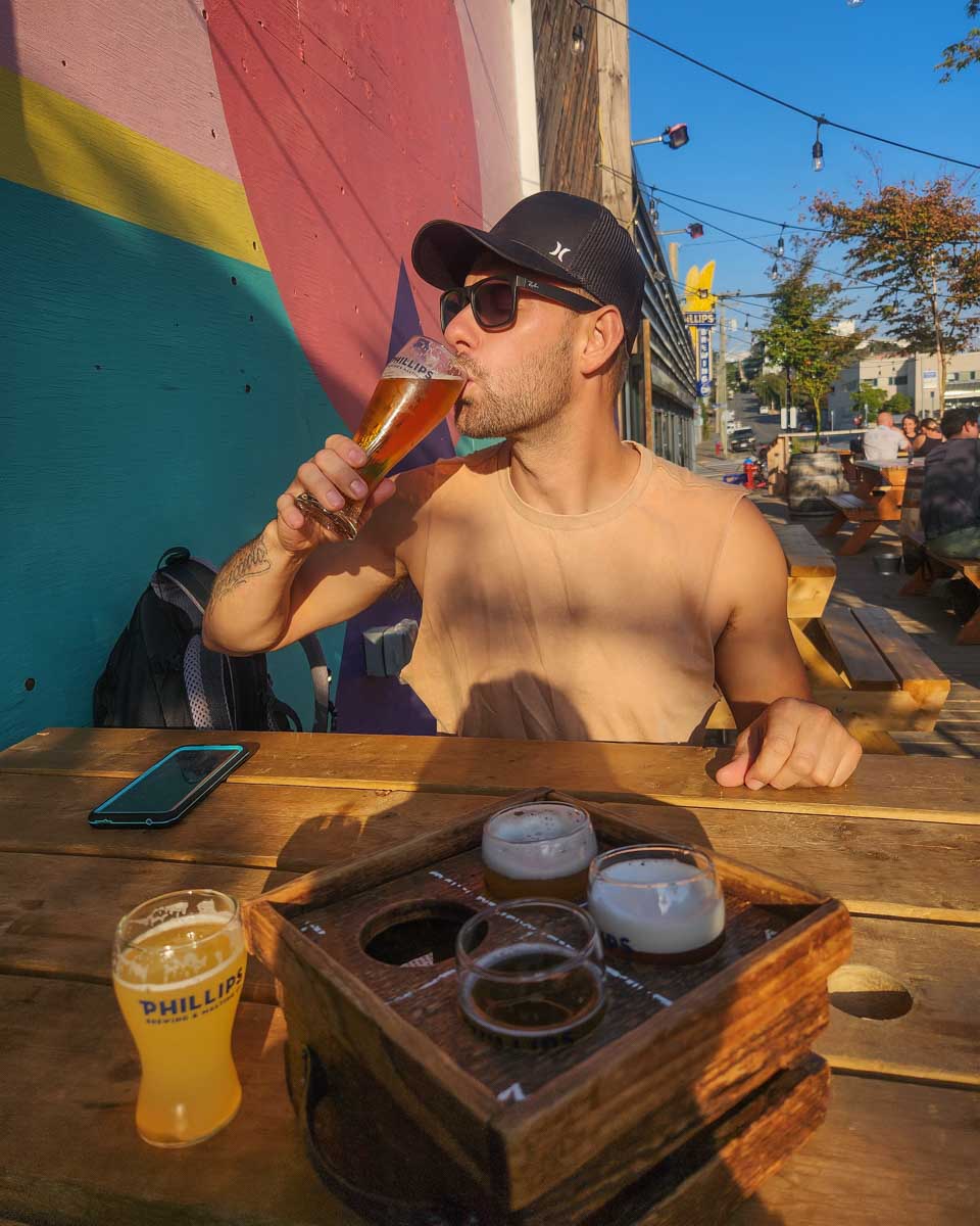 Daniel drinks his beer at Phillips Brewery in Victoria, BC
