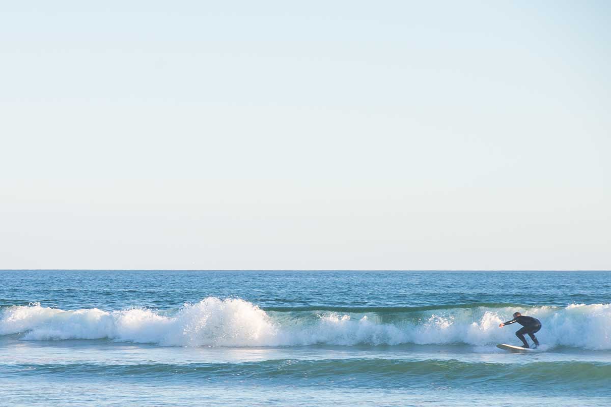 Daniel surfing at Long Beach in Pacific Rim National Park, Tofino