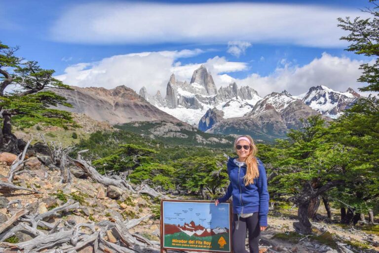 Bailey stands at a viewpoint on the trail with Mount Fitz Roy Laguna de los Tres in the background