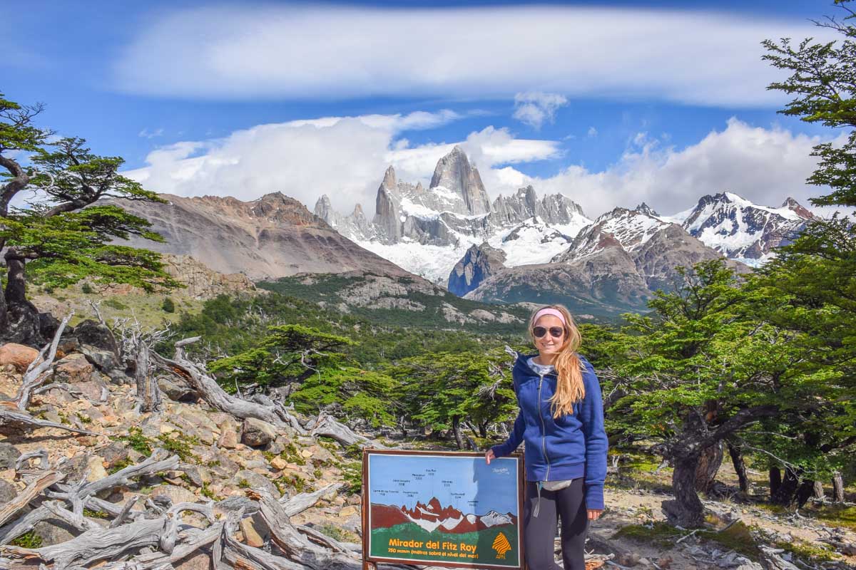 Bailey stands at a viewpoint on the trail with Mount Fitz Roy Laguna de los Tres in the background