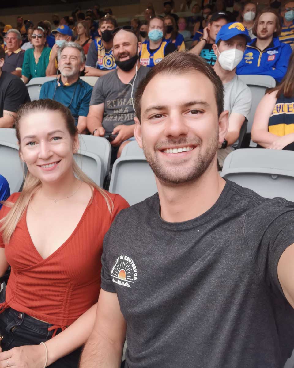 Daniel and Bailey at a football game in Australia