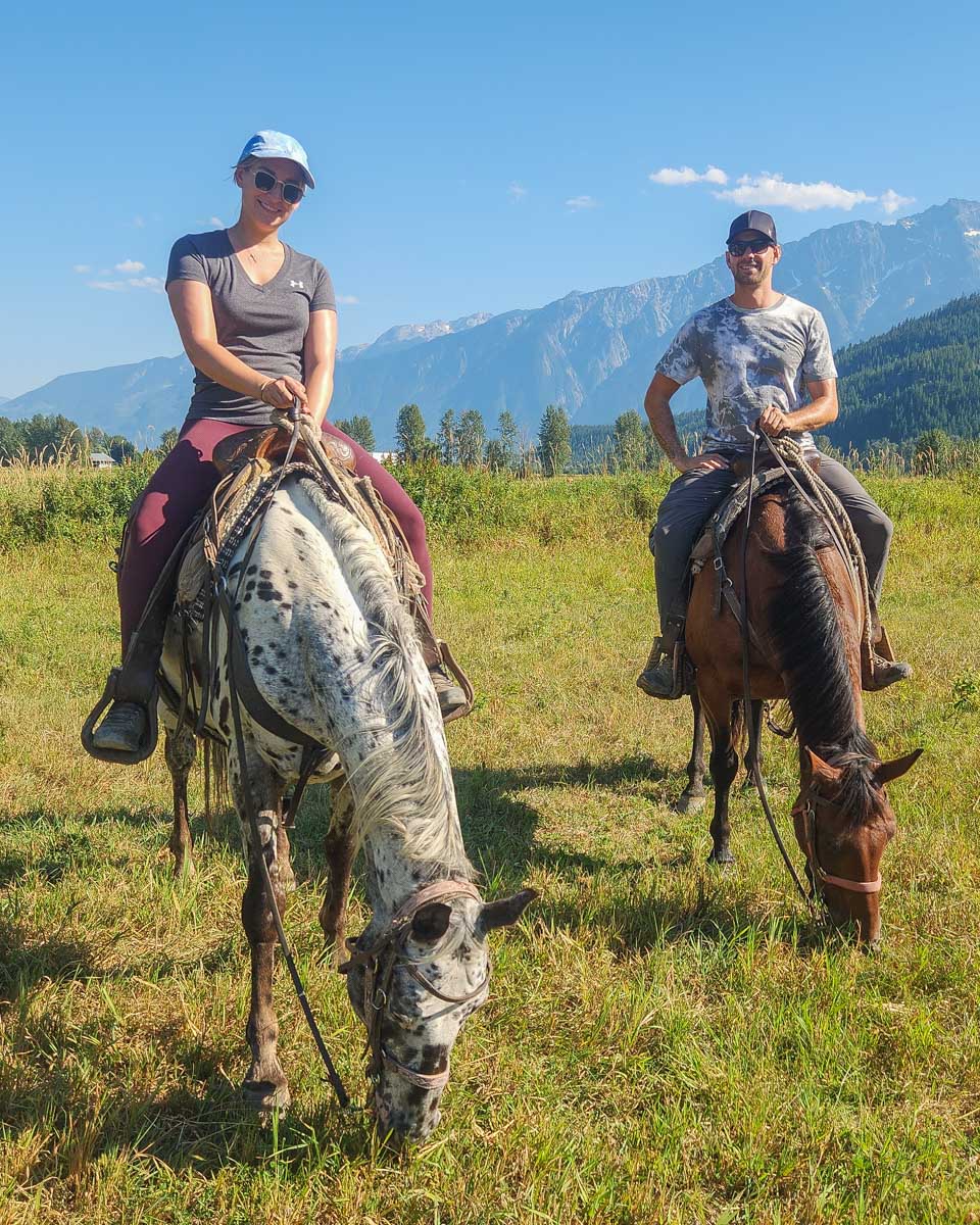 Daniel and Bailey pose for a photo while horseback riding in Pemberton, BC