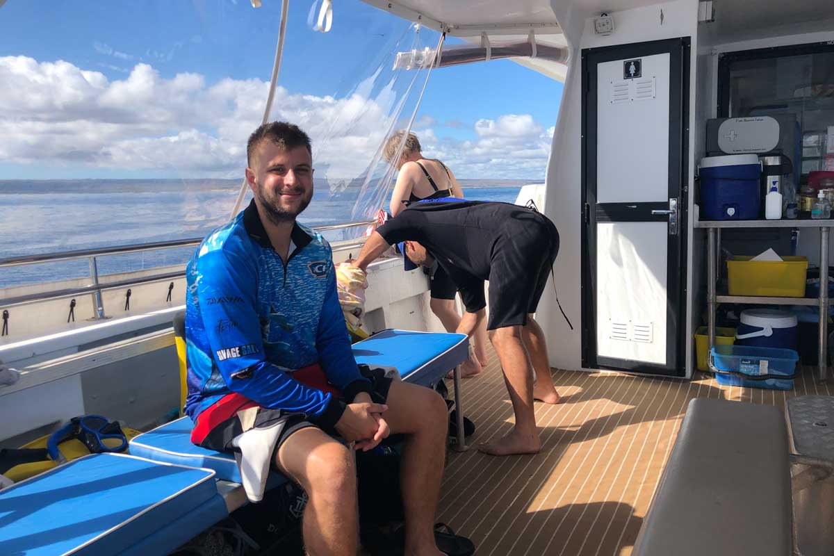 Daniel brother relaxes on the boat on his whale shark tour in Exmouth