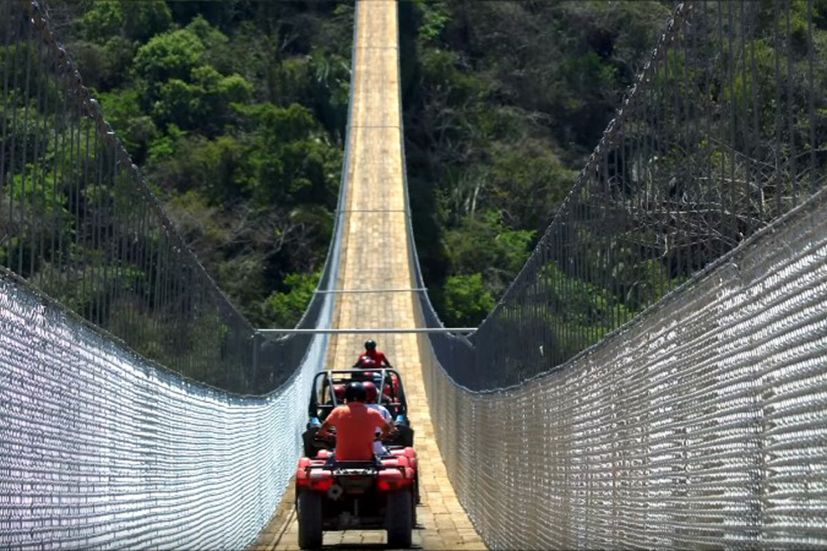 crossing a suspension bridge in ATV at Puerto Vallarta, Mexico