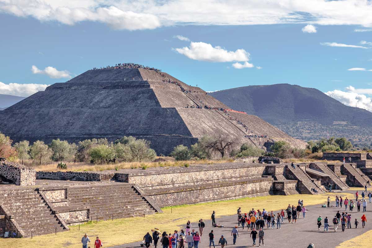 Wide view of Teotihuacan, Mexico with tourists walking the grounds