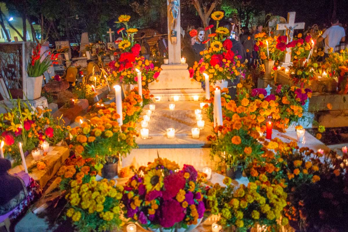 A grave decorated in Marigold flowers during Day of the Dead in Oaxaca, Mexico