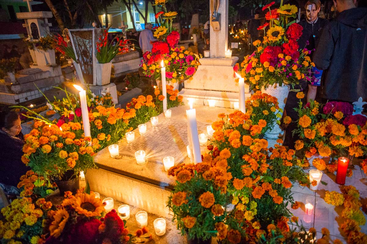 A grave decorated in Marigold flowers during Day of the Dead in Oaxaca, Mexico