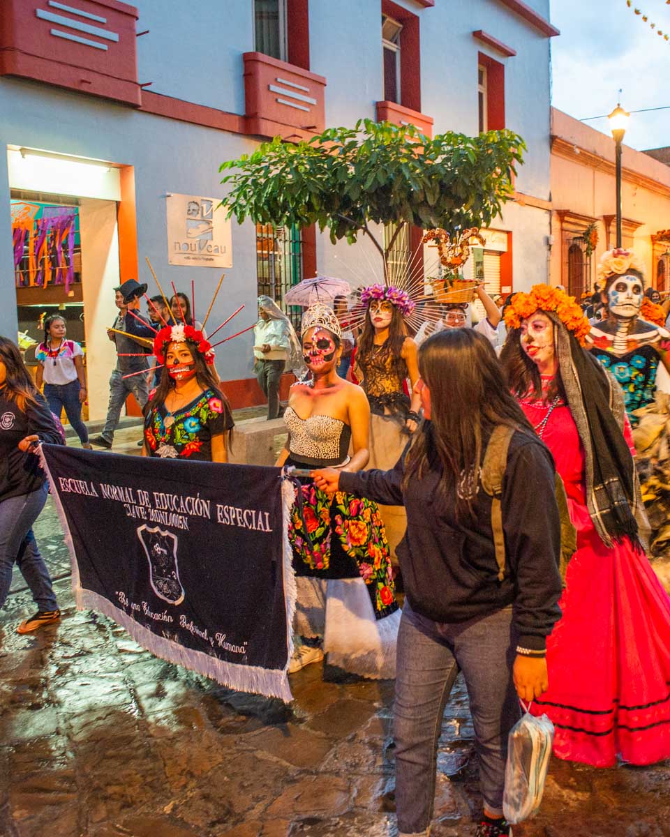 A parade during Día de los Muertos in oaxaca