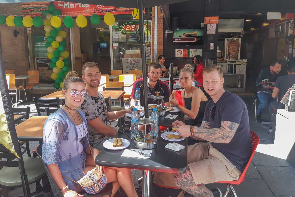 Bailey-and-Daniel-with-friends-in-Mexico-City-eating-at-a-taco-restaurant