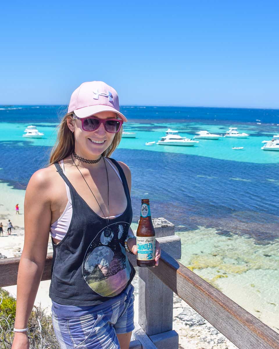 Bailey with a beer overlooking a beach on Rottnest Island