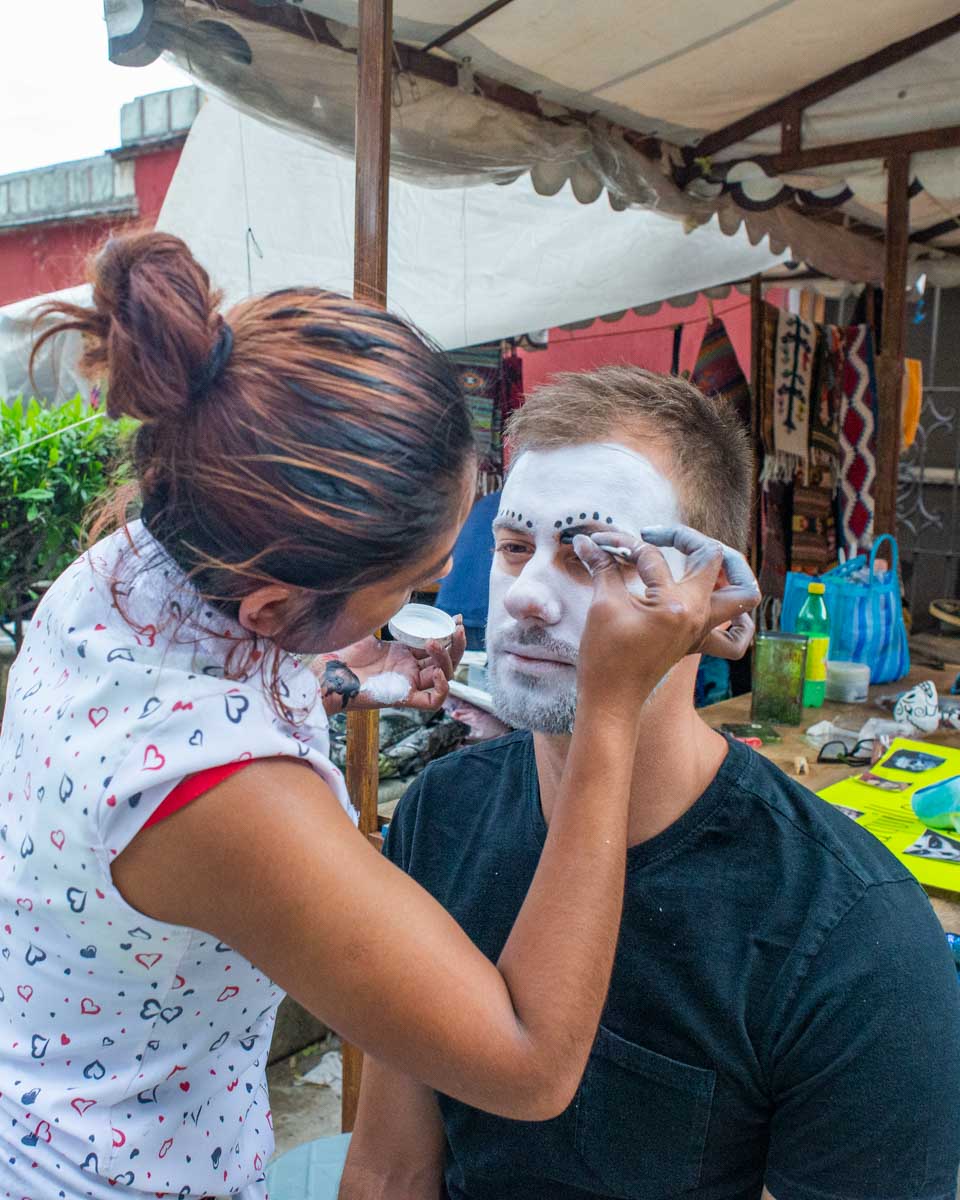 Daniel gets his face painted during Día de los Muertos in Oaxaca, Mexico