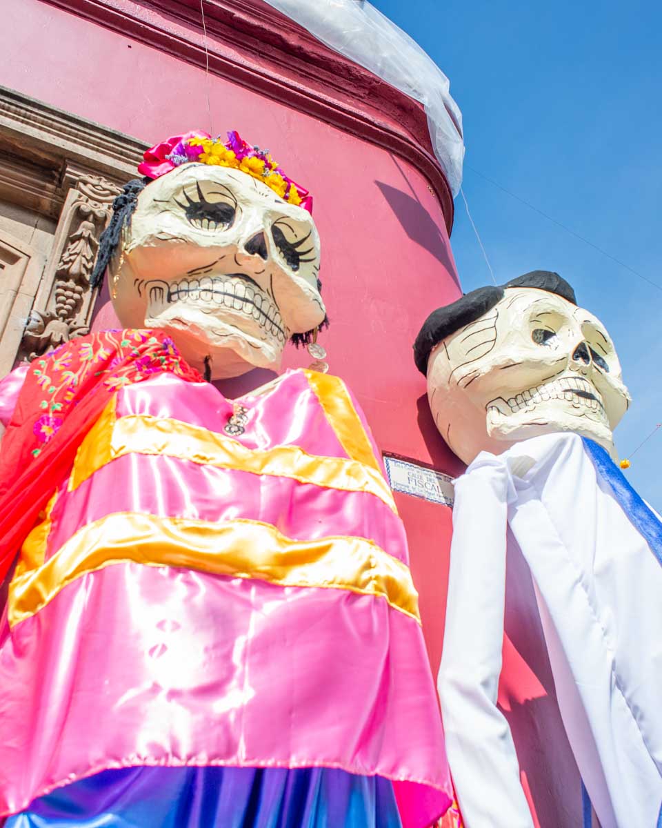 Two giant puppets in Oaxaca during Día de los Muertos