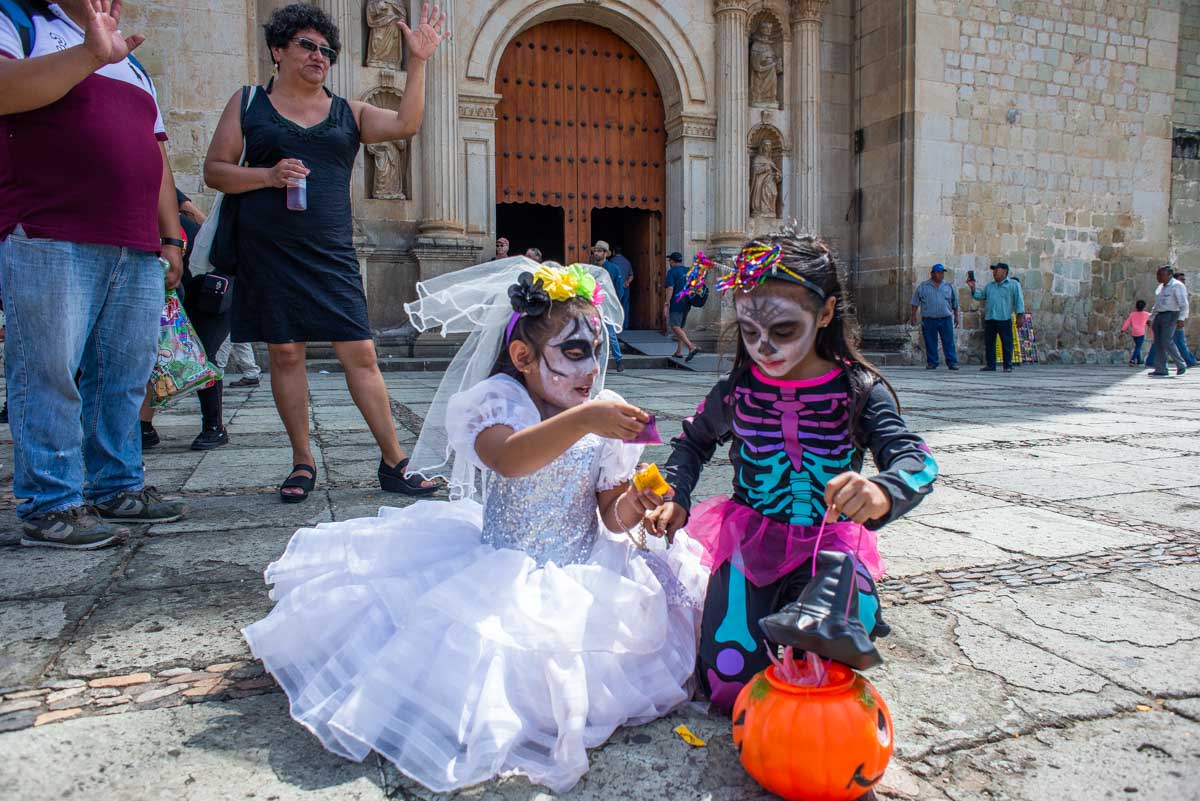 Two kids in Oaxaca during Día de los Muertos, Mexico