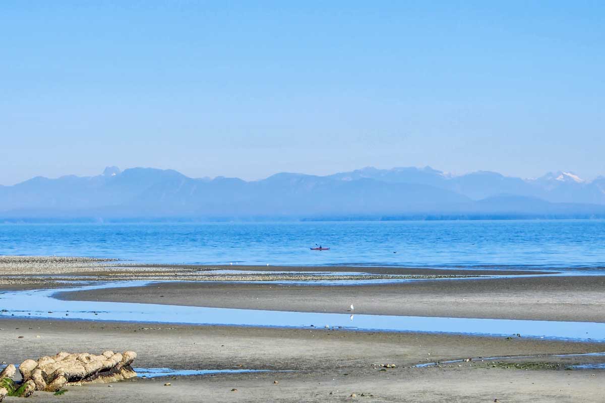 A man kayaks at Miracle Beach near Campbell River, BC