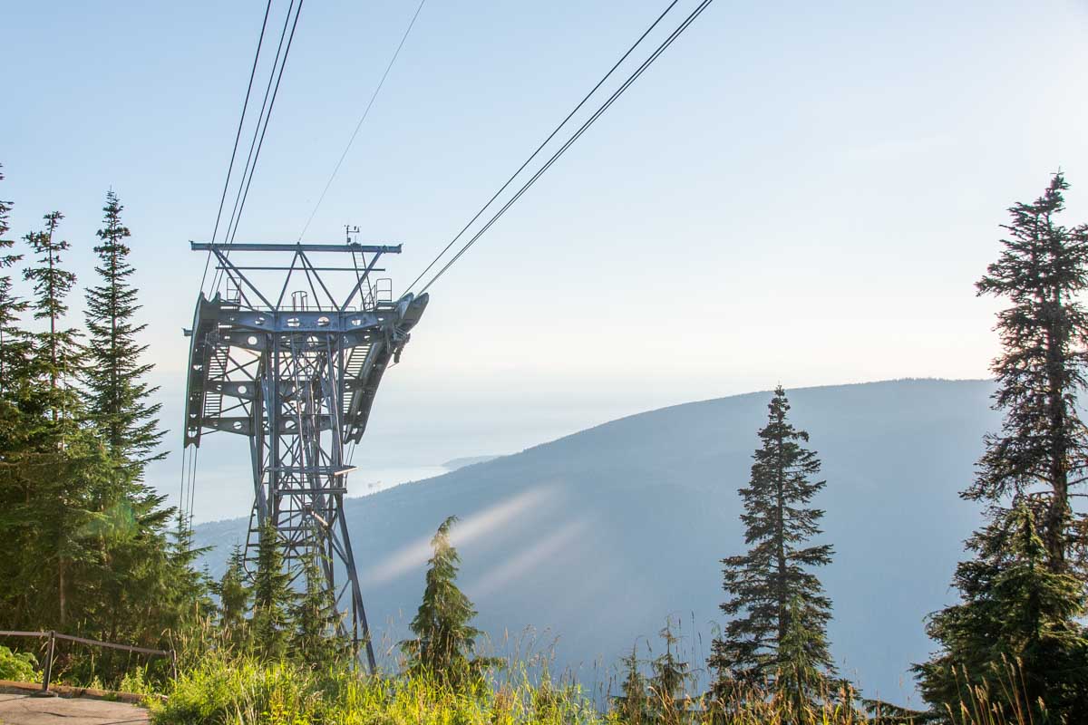A sunset view of a gondola cable stand at Grouse Mountain, Vancouver