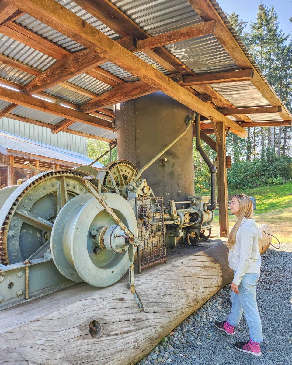 Bailey looks at machinery at the museum of Campbell River