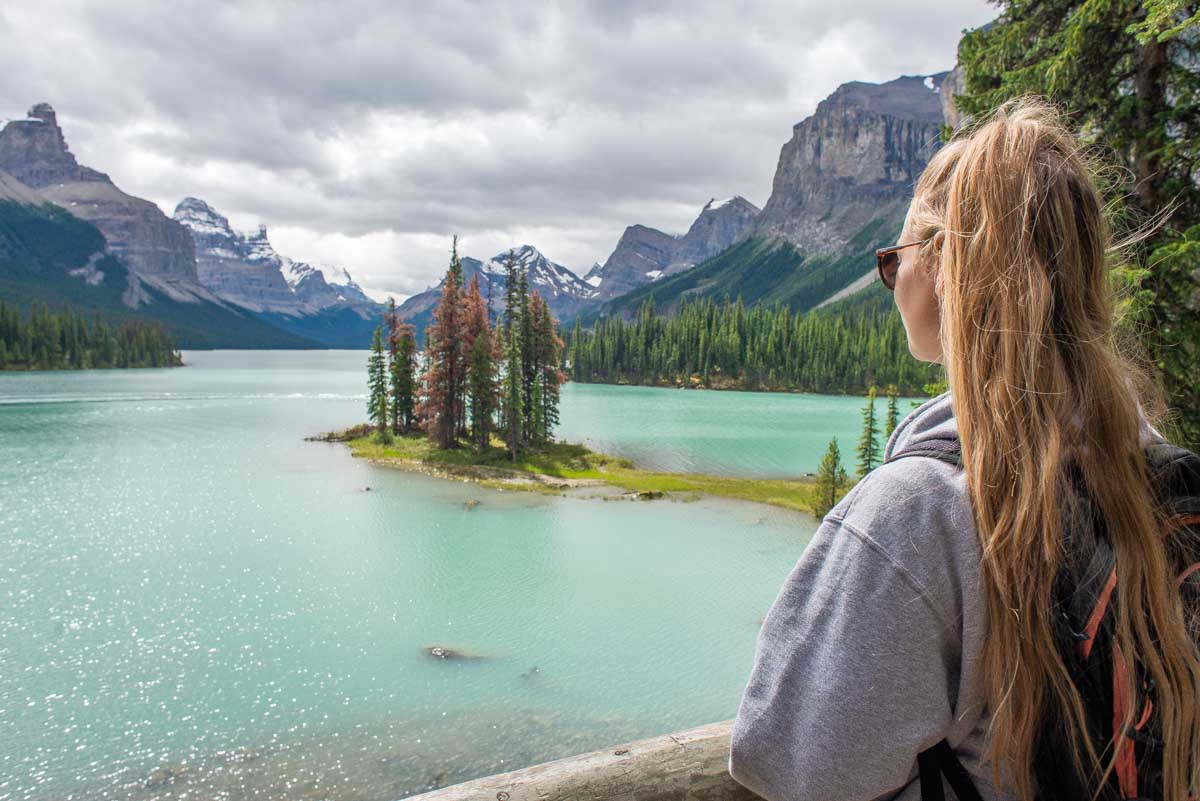 Bailey looks over at Spirit Island on the boardwalk at Maligne Lake, Canada