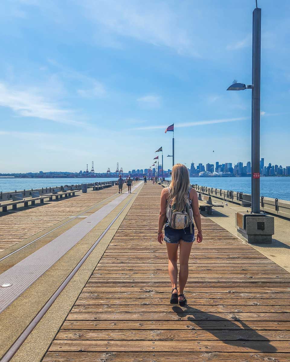 Bailey walks the Burrard Dry Dock Pier in Lonsdale Quay, Vancouver