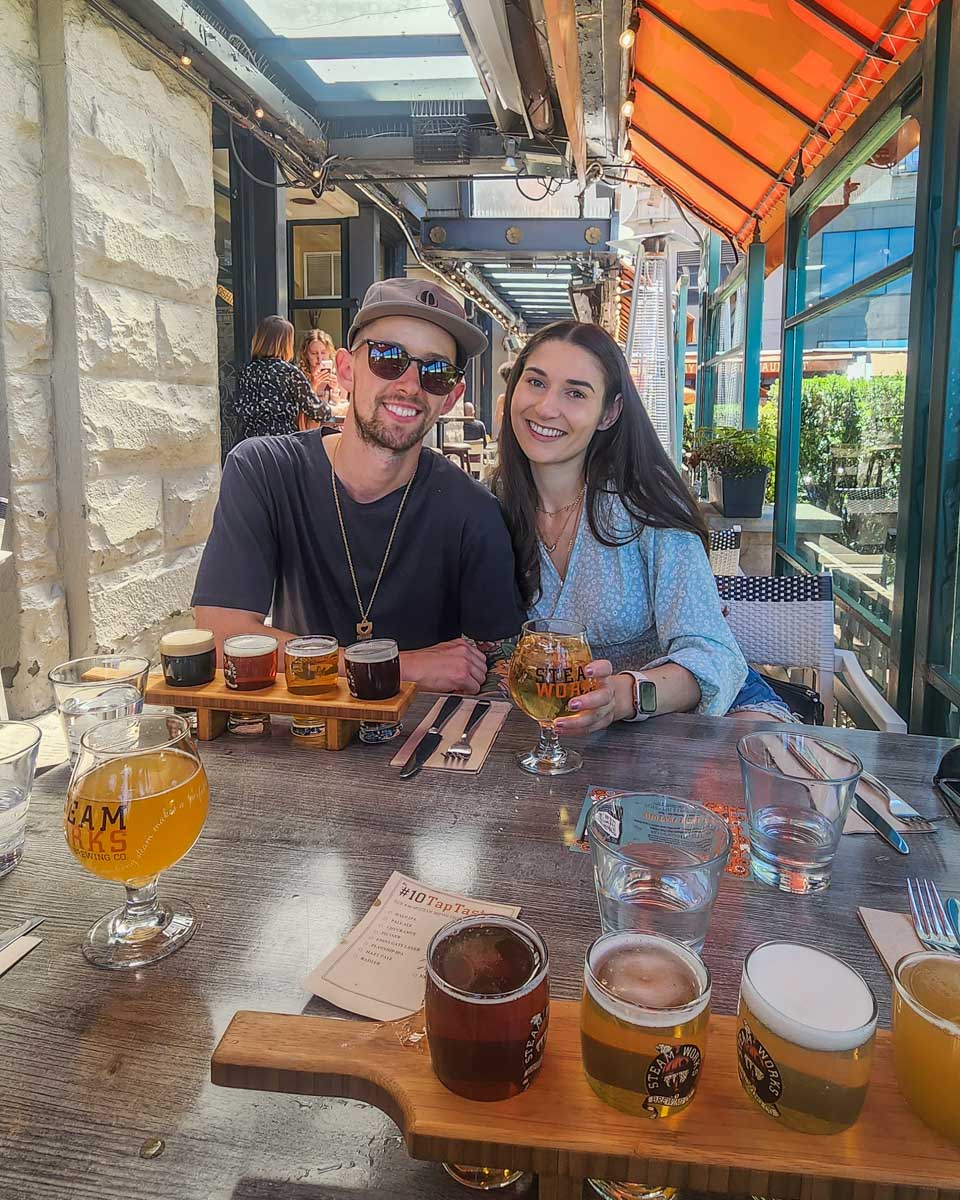 Baileys sister and partner enjoy a drink at Steamworks Brewery in Gastown, Vancouver