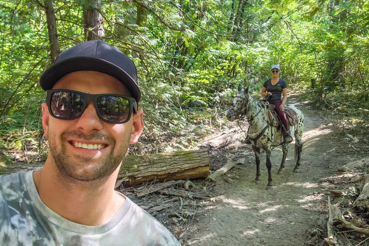 Daniel and Bailey horseback riding at Boundary Ranch
