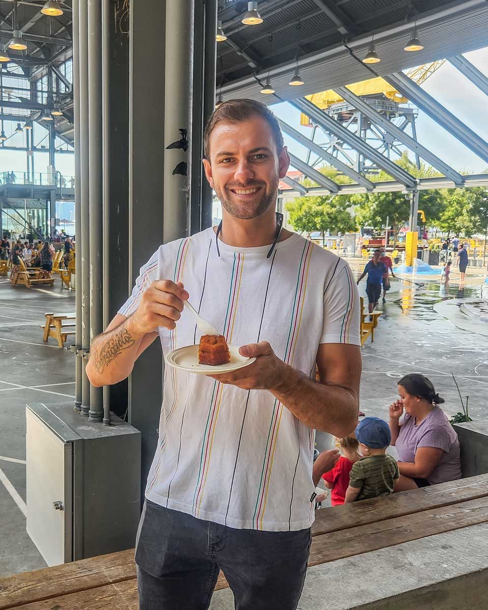 Daniel enjoys Honey Cake at Main Street Honey Shoppe at The Shipyards