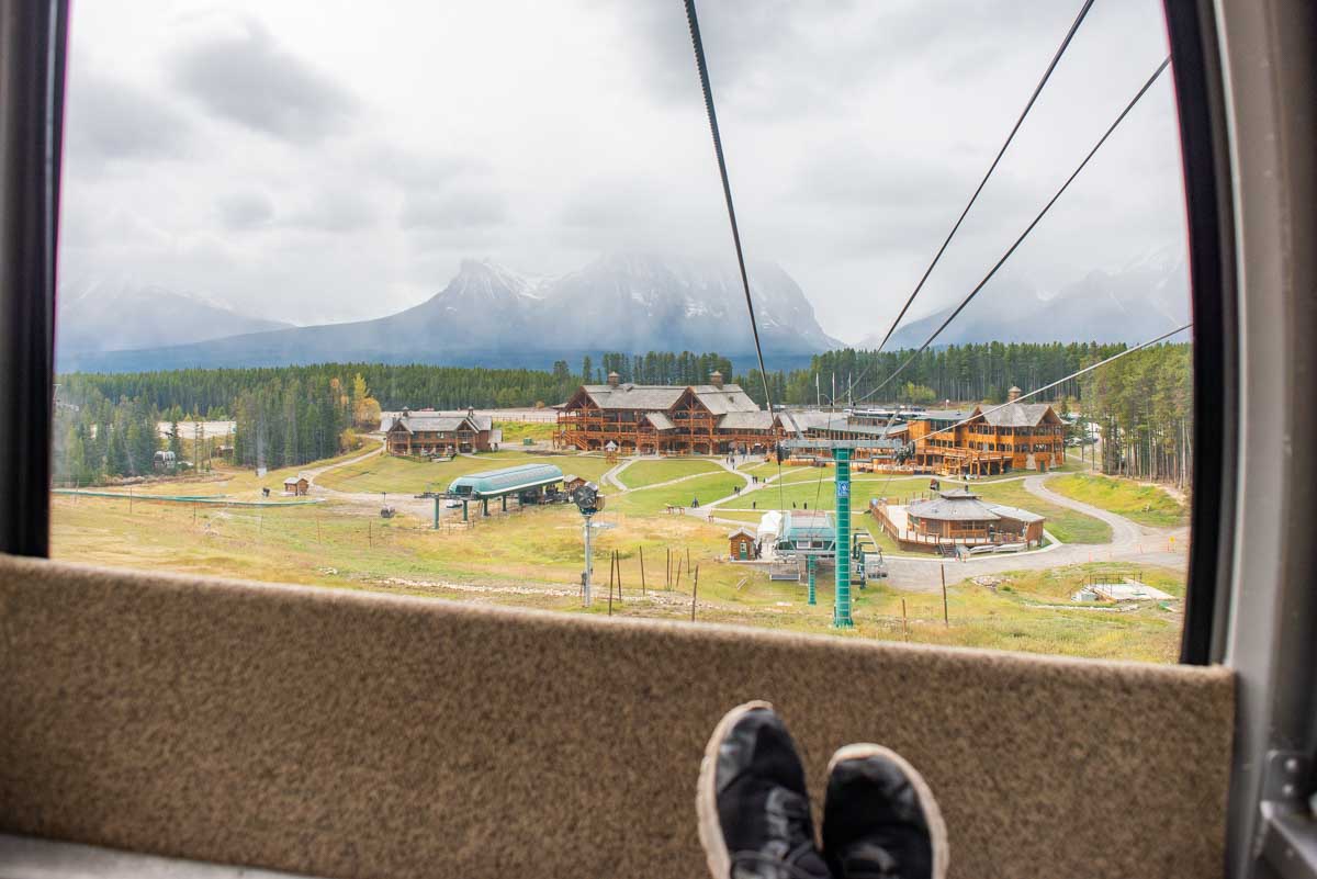 Daniel rests his feet inside the Lake Louise Gondola