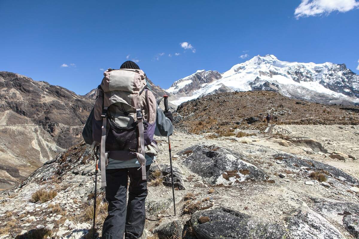 a person treks on Huayna Potosi in Bolivia