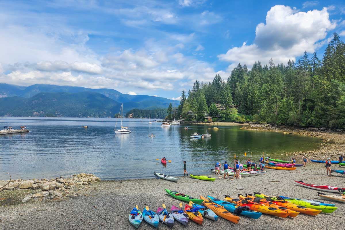Kayaks line the beach in Deep Cove, Vancouver