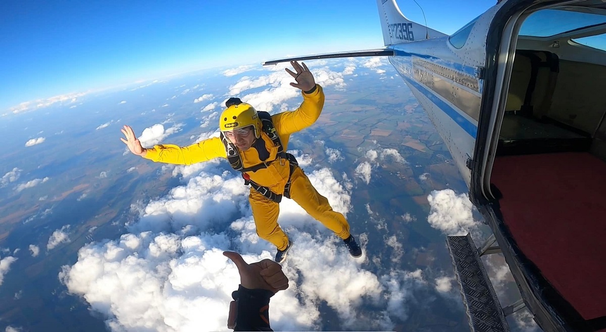 a man jumps out of a small plane in Santa Crus Bolivia