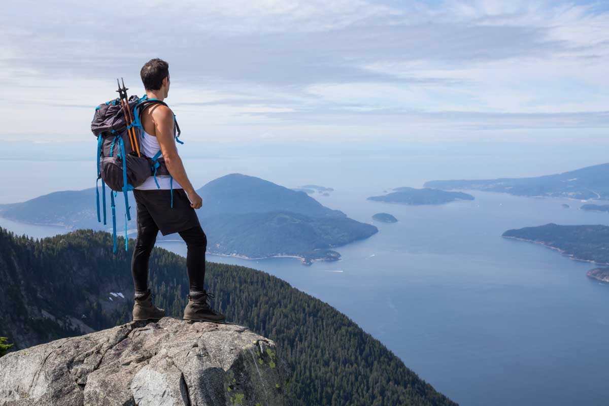 A man stands on the Lions Trail near Vancouver, Canada