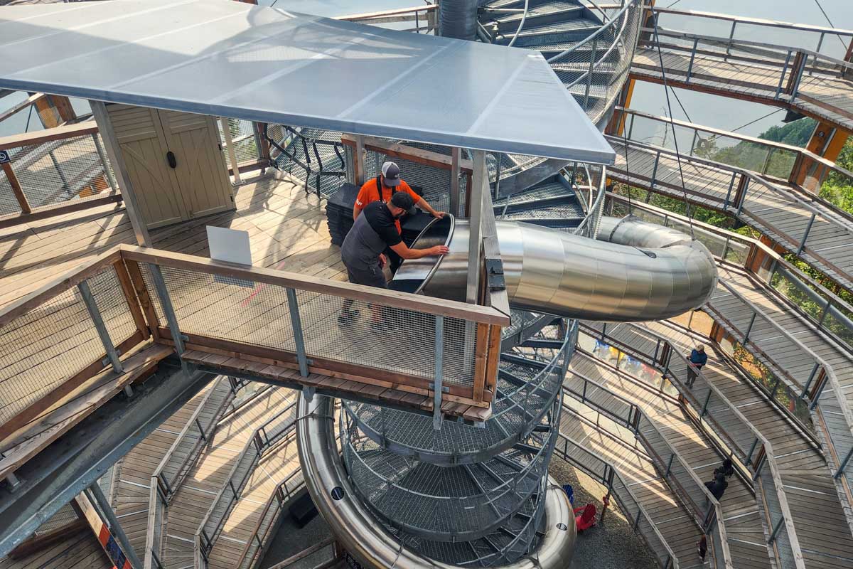 A person prepares to go down the slide at the Malahat Skywalk in Malahat, British Columbia