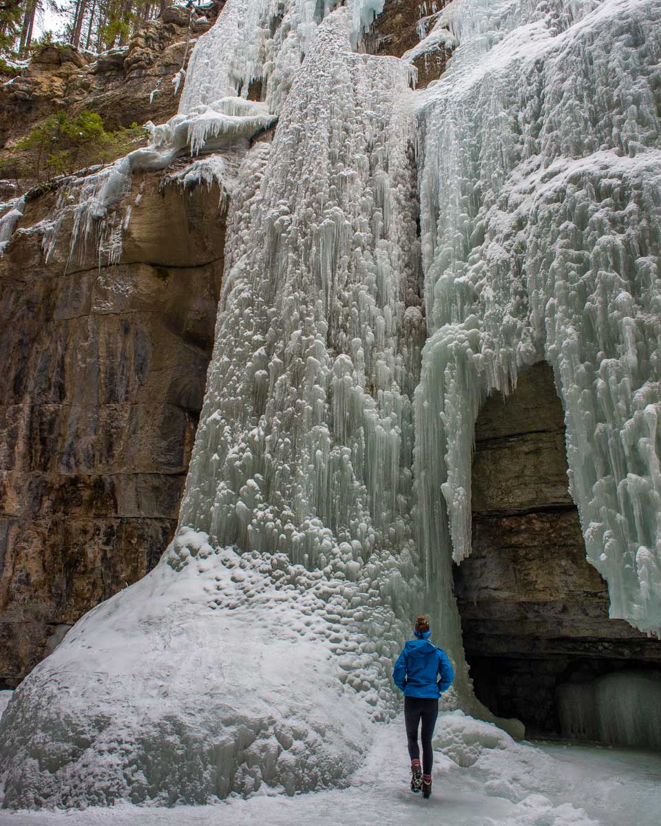 Bailey looks at a frozen waterfall in Maligne Canyon