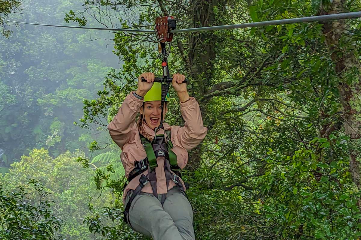 Bailey smiles at the camera while Ziplining in Cancun, Mexico