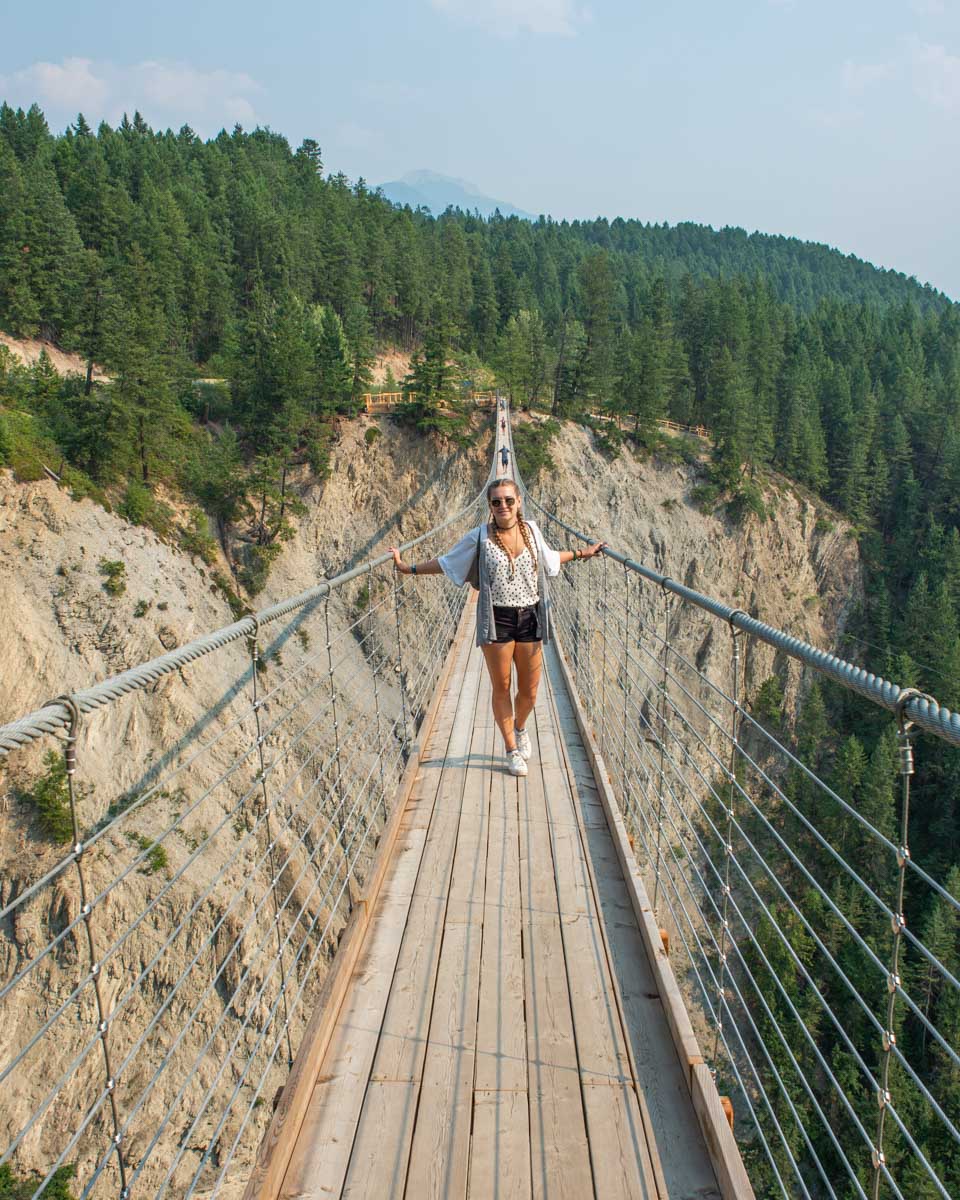 Bailey smiles at the camera while on the Golden Suspension Bridge in Golden, BC