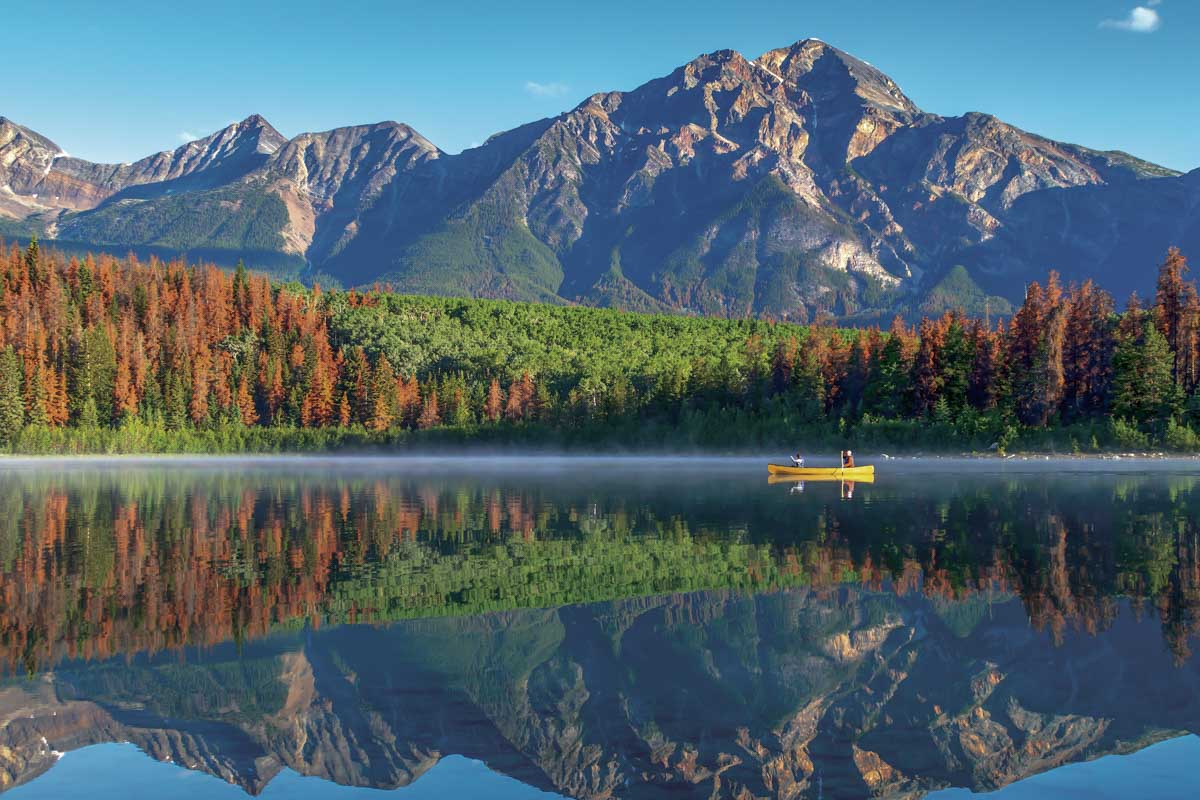 Two people canoe on Pyramid Lake, Jasper