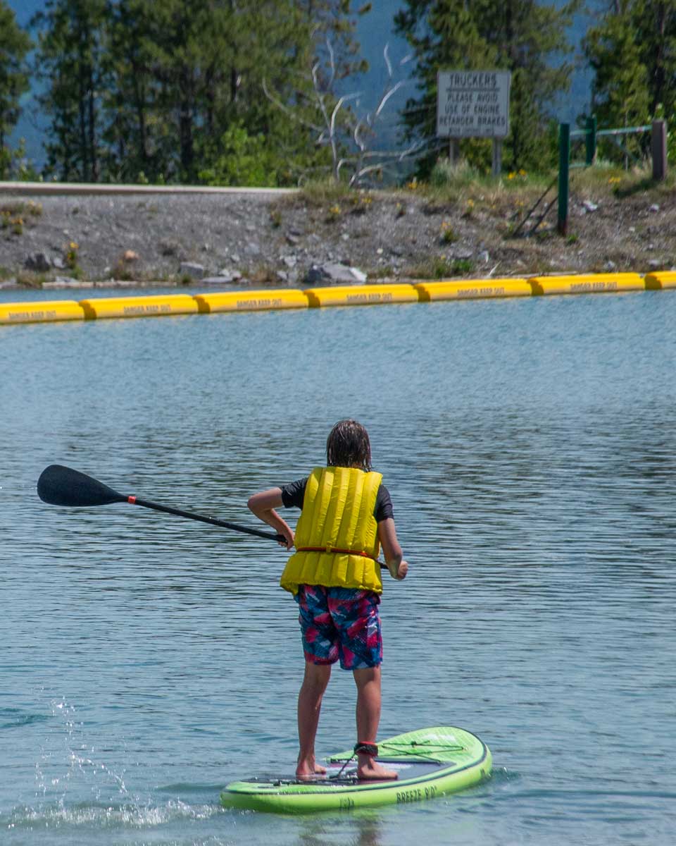 A kid SUPs in Canmore
