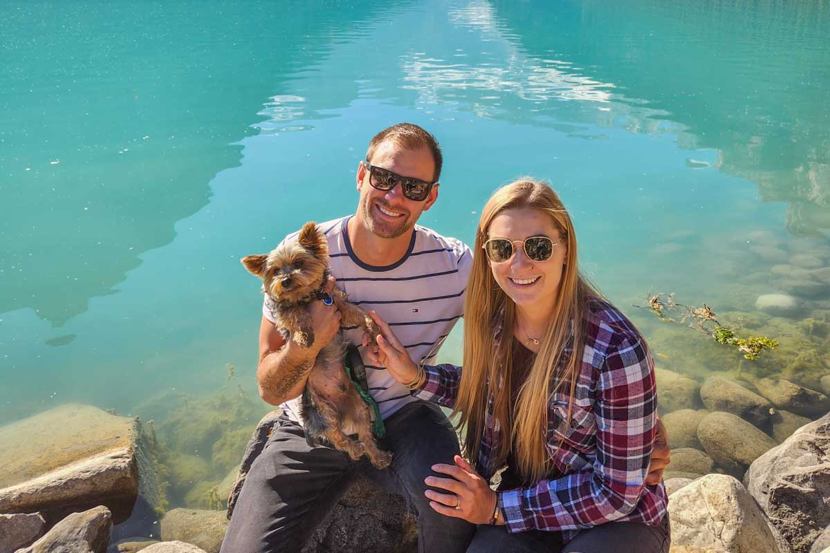 Bailey and Daniel at the edge of Lake Louise in Banff