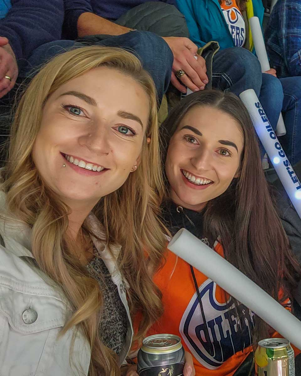 Bailey and her sister cheer for the Edmonton Oilers at Rogers Place, Edmonton