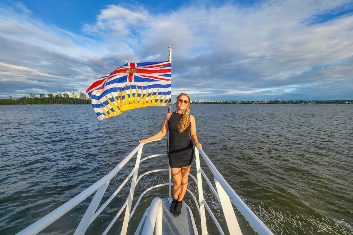 Bailey at the front of the boat on a sunset cruise in Vancouver
