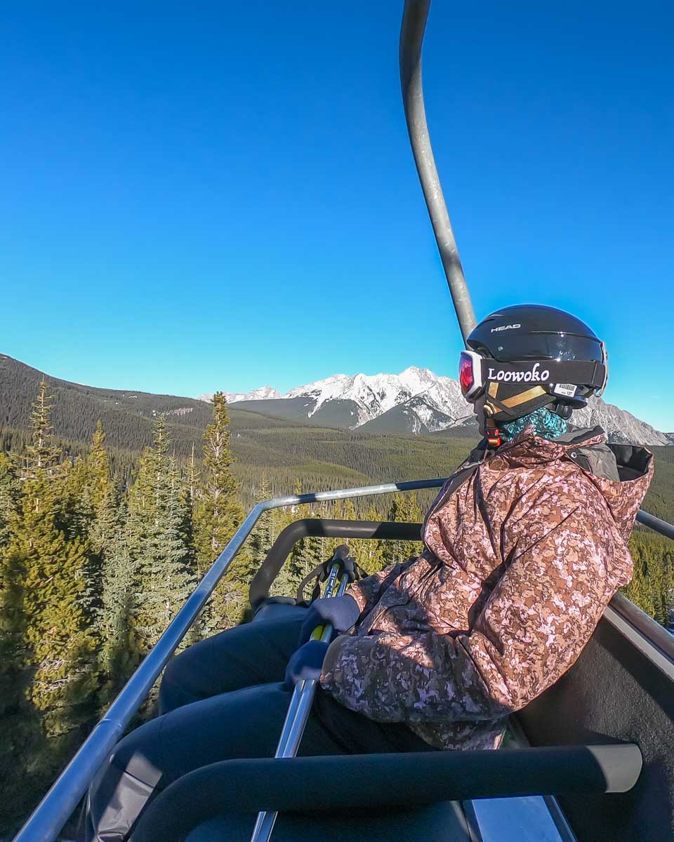 Bailey on the chairlift up to Nakiska near Canmore, Alberta