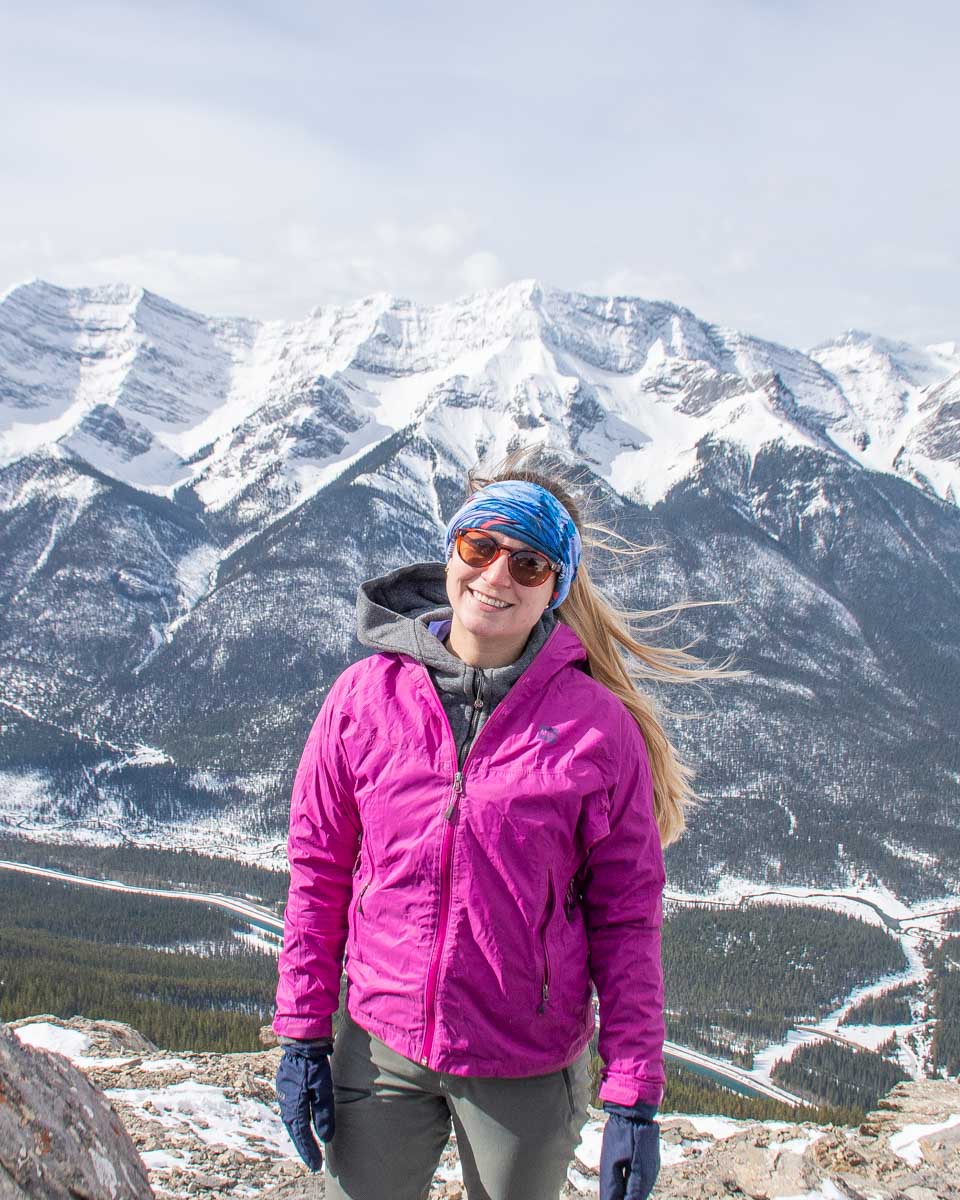 Bailey poses for a photo at the top of Ha Ling Peak, Canmore