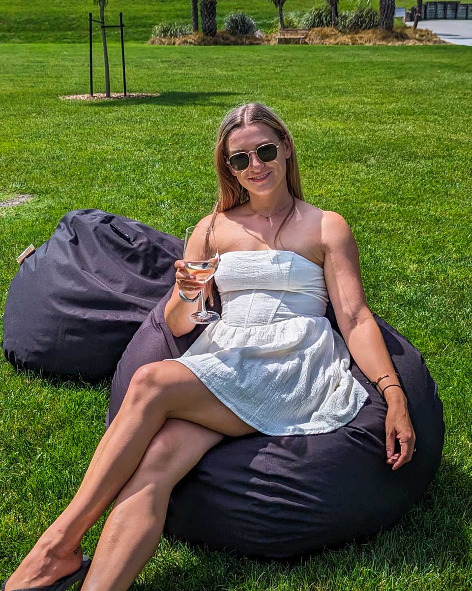 Bailey relaxes on a bean bag at a winery in Naramata Bench, Penticton