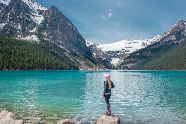 Bailey stands on the edge of Lake Louise in Banff National Park