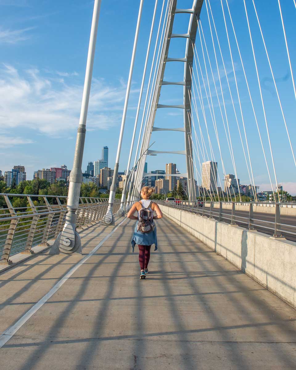 Bailey walks across the Walterdale Bridge in the river valley in Edmonton Alberta