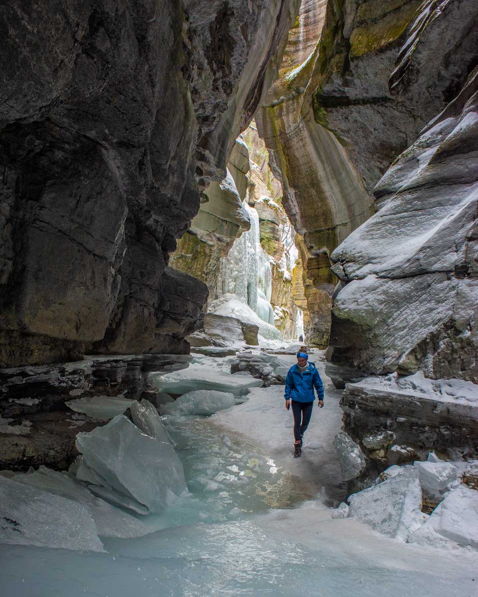 Bailey walks along briken ice in Maligne Canyon, Jasper