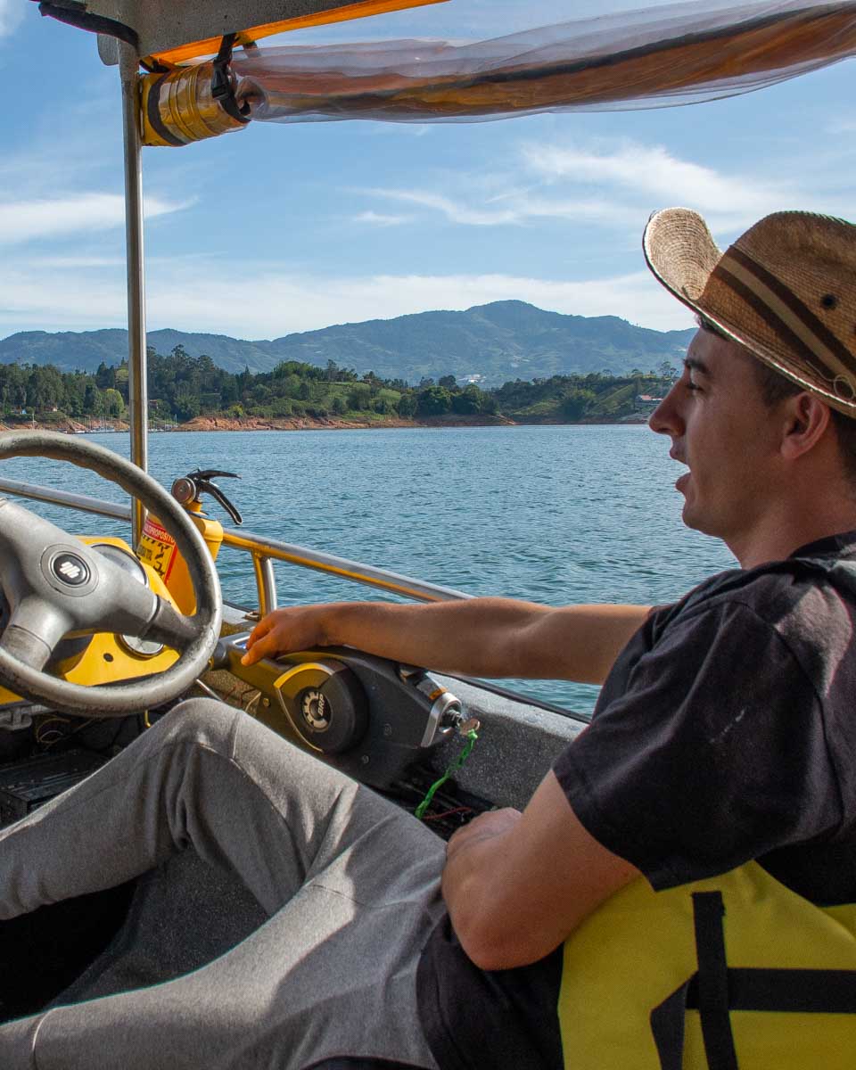 Boat driver on Guatape Lake in Colombia