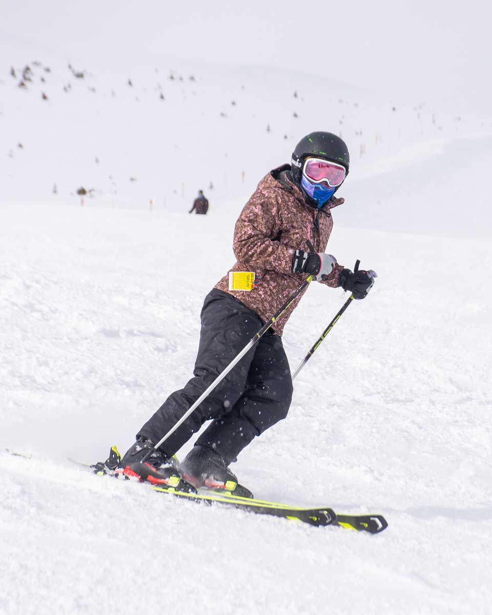 Close up of Bailey skiing down Marmot Basin in Jasper National Park