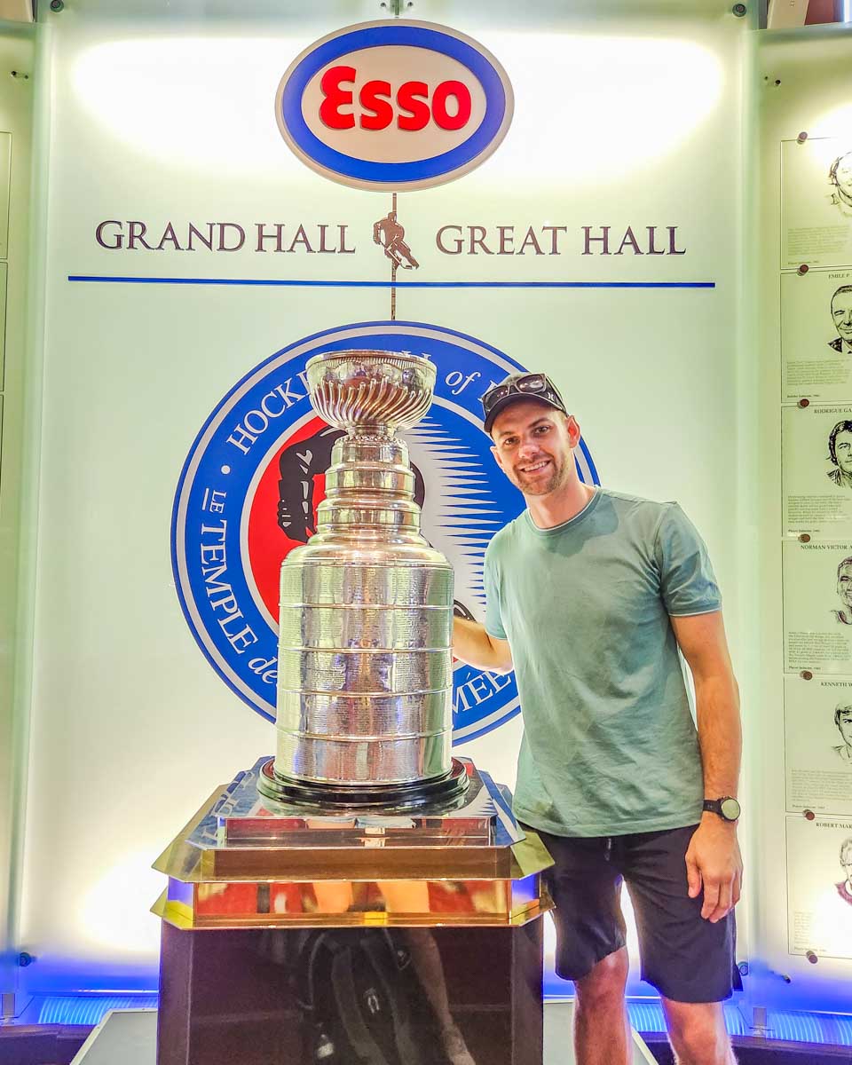 Daniel poses for a photo with the current Stanley Cup at the Hockey Hall of Fame in Toronto, Canada