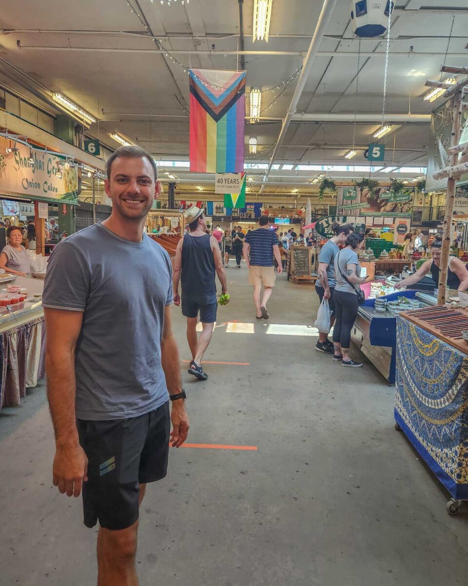 Daniel poses for the camera inside Strathcona Farmers Market in Edmonton