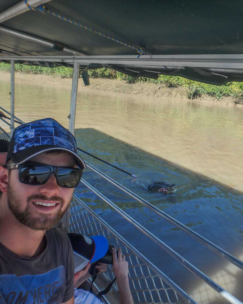 Daniel takes a slefie with a crocodile on a tour from Darwin